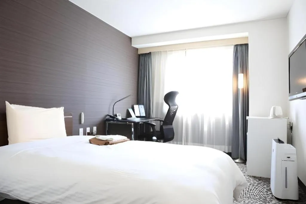 Bed in Hotel Sunshine Iwaki