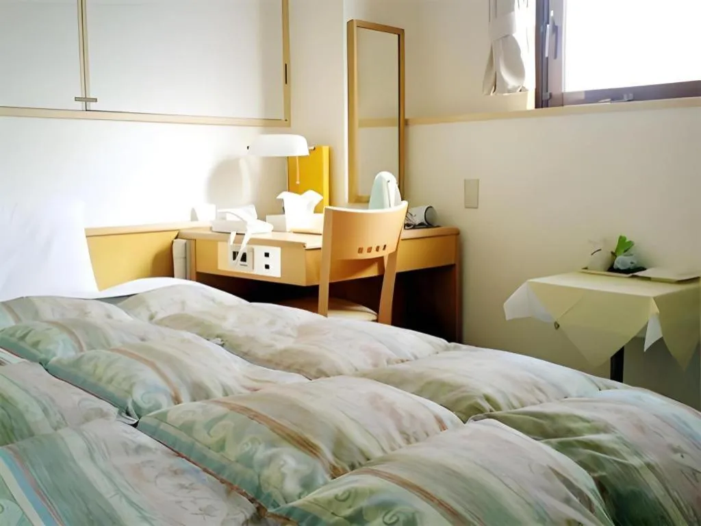 Bed in Hotel Sunshine Iwaki