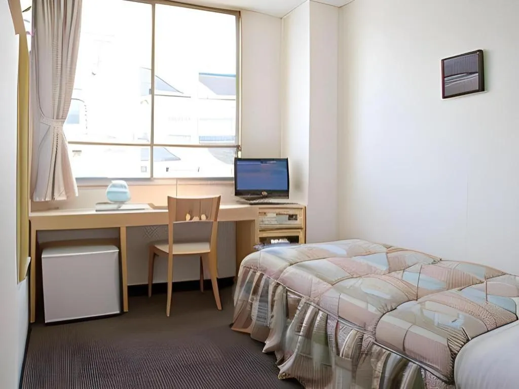 Bed in Hotel Sunshine Iwaki