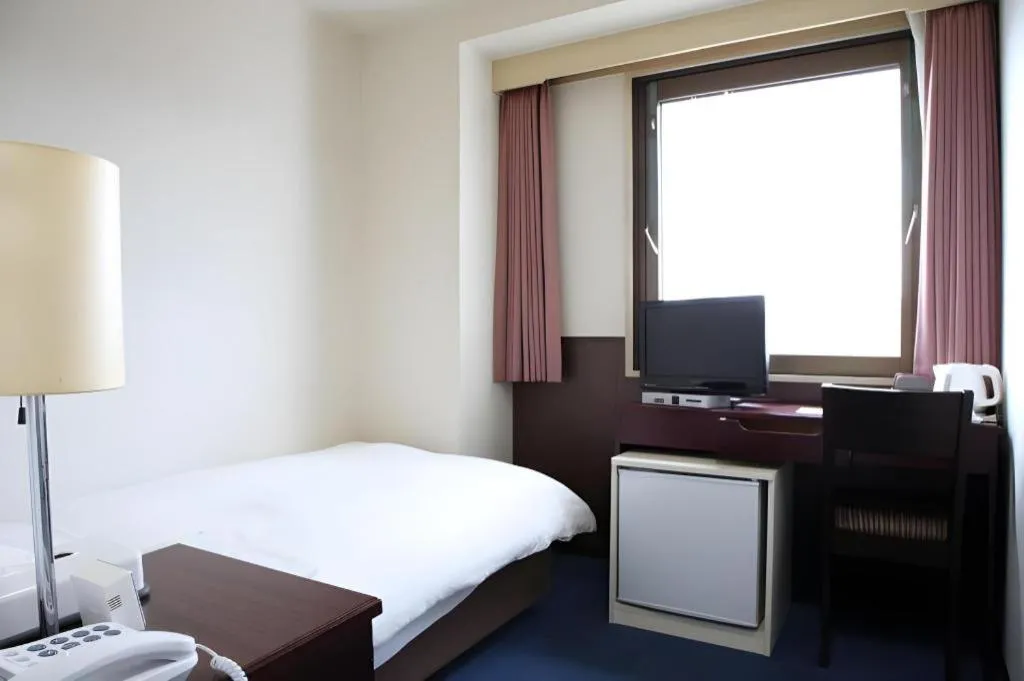 Bed in Hotel Sunshine Iwaki