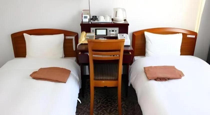 Bed in Hotel Sunshine Iwaki