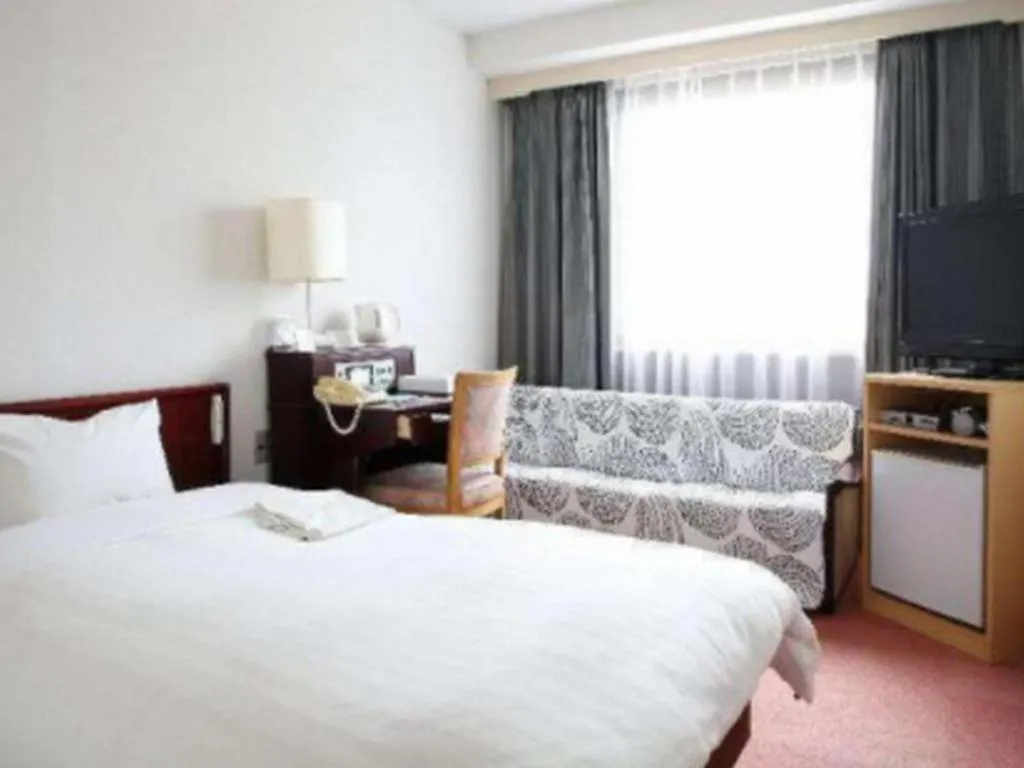 Bed in Hotel Sunshine Iwaki