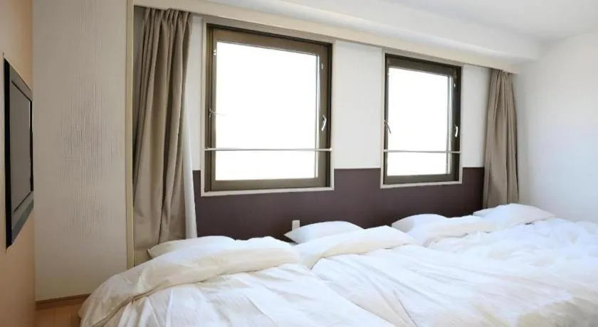 Bed in Hotel Sunshine Iwaki