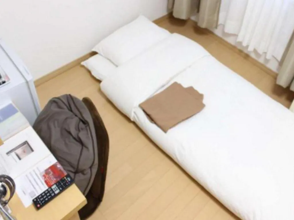 Bed in Hotel Sunshine Iwaki