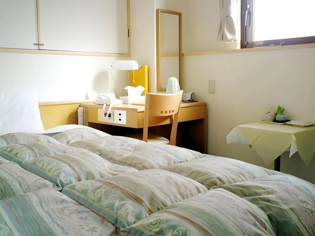 Bed in Hotel Sunshine Iwaki