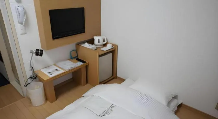 Bed in Hotel Sunshine Iwaki