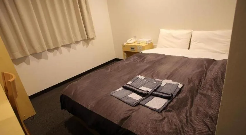 Bed in Hotel Sunshine Iwaki