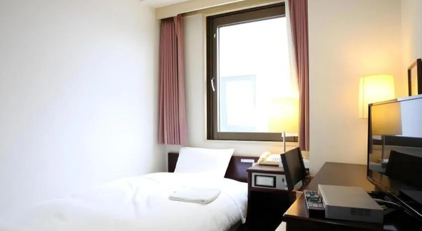 Bed in Hotel Sunshine Iwaki