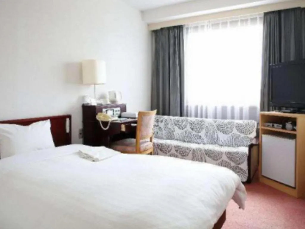 Bed in Hotel Sunshine Iwaki