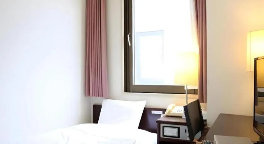 Bed in Hotel Sunshine Iwaki