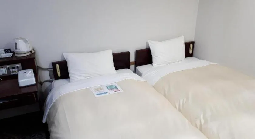Bed in Hotel Sunshine Iwaki
