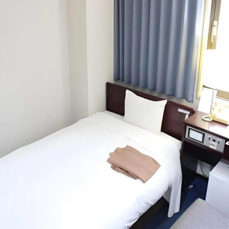 Bed in Hotel Sunshine Iwaki