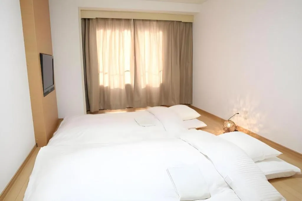 Bed in Hotel Sunshine Iwaki