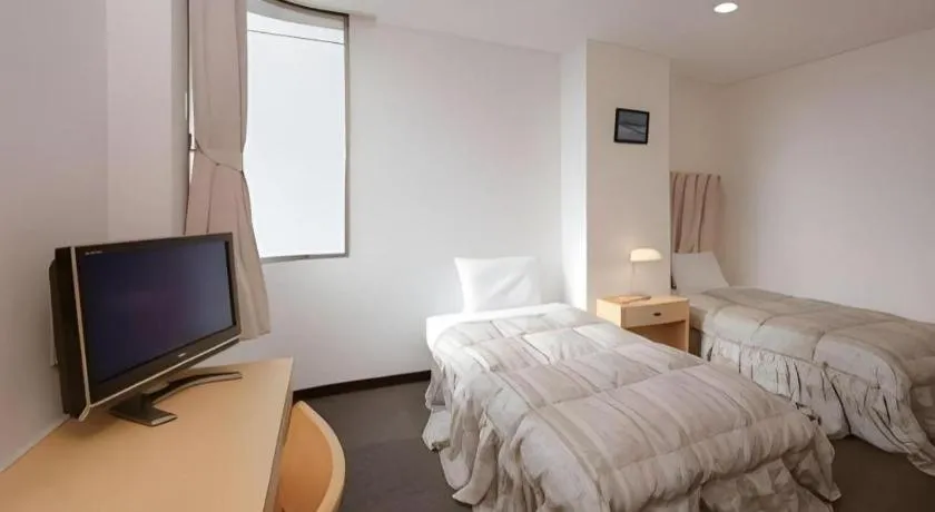 Bed in Hotel Sunshine Iwaki