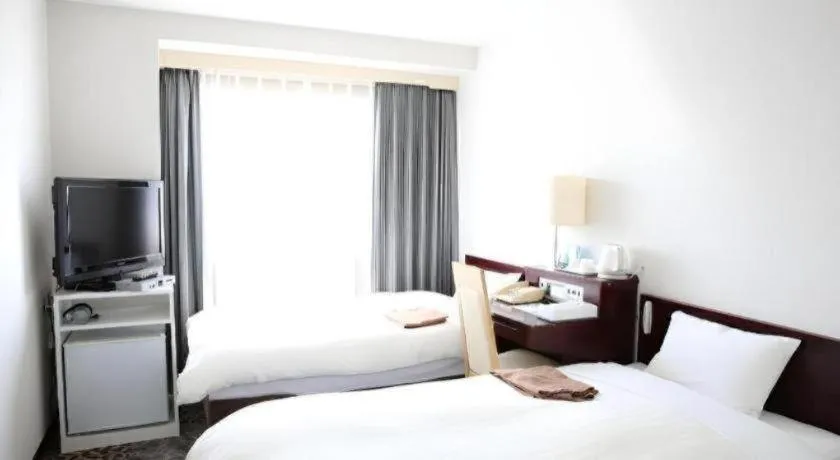 Bed in Hotel Sunshine Iwaki