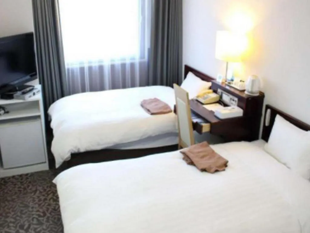 Bed in Hotel Sunshine Iwaki