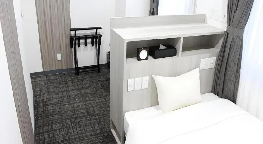 Bed in Hotel Sunshine Iwaki