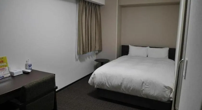 Bed in E Hotel Kumagaya Annex