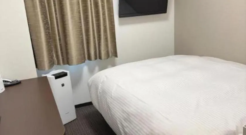 Bed in E Hotel Kumagaya Annex