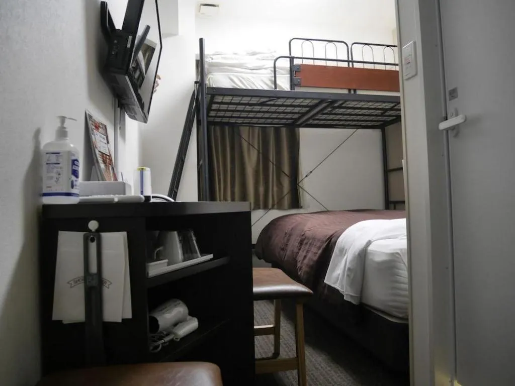 Bed in E Hotel Kumagaya Annex