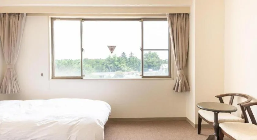 Bed in Tabist Yabuki Station Hotel