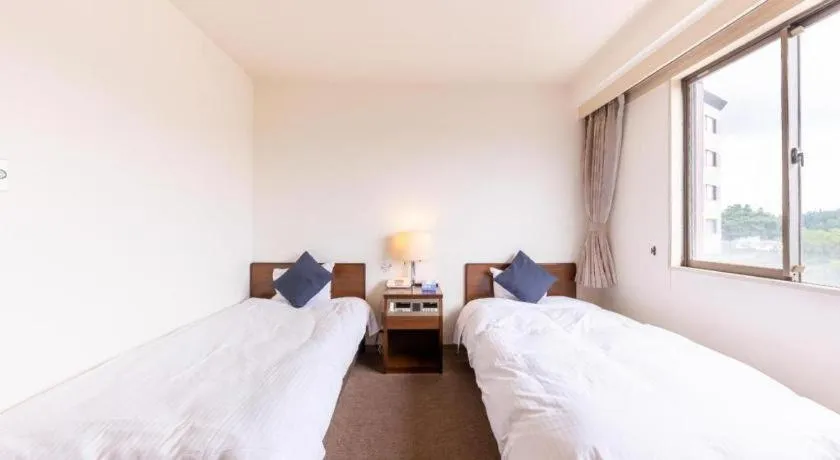 Bed in Tabist Yabuki Station Hotel