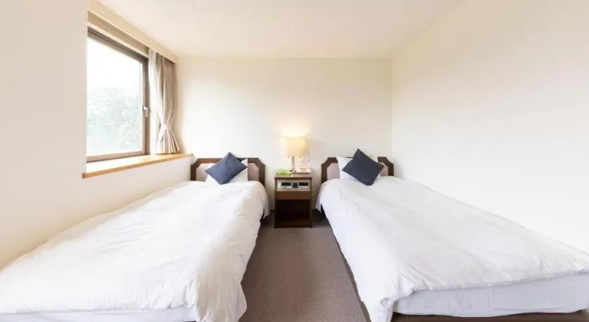 Bed in Tabist Yabuki Station Hotel