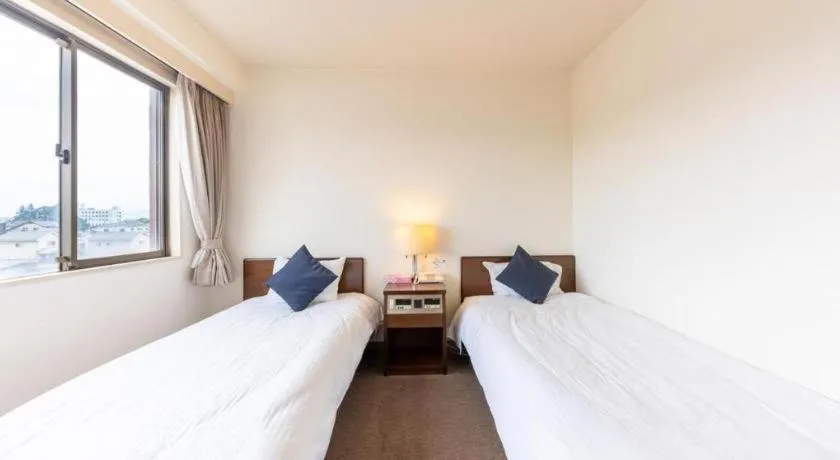 Bed in Tabist Yabuki Station Hotel