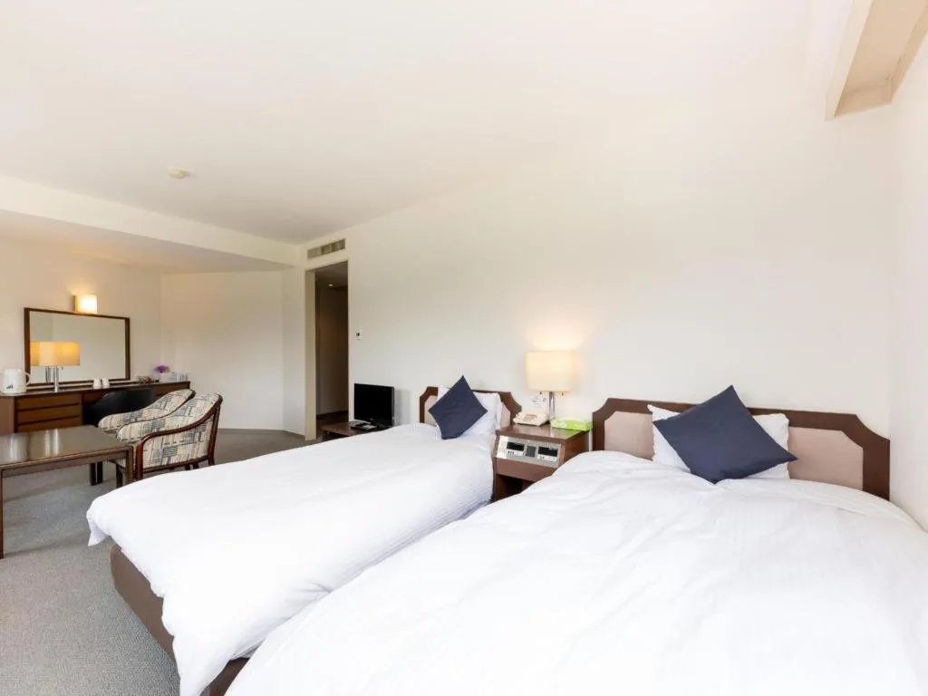 Bed in Tabist Yabuki Station Hotel