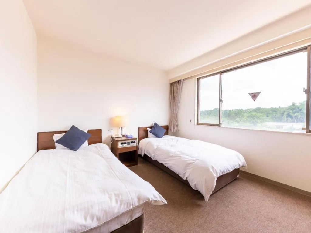 Bed in Tabist Yabuki Station Hotel