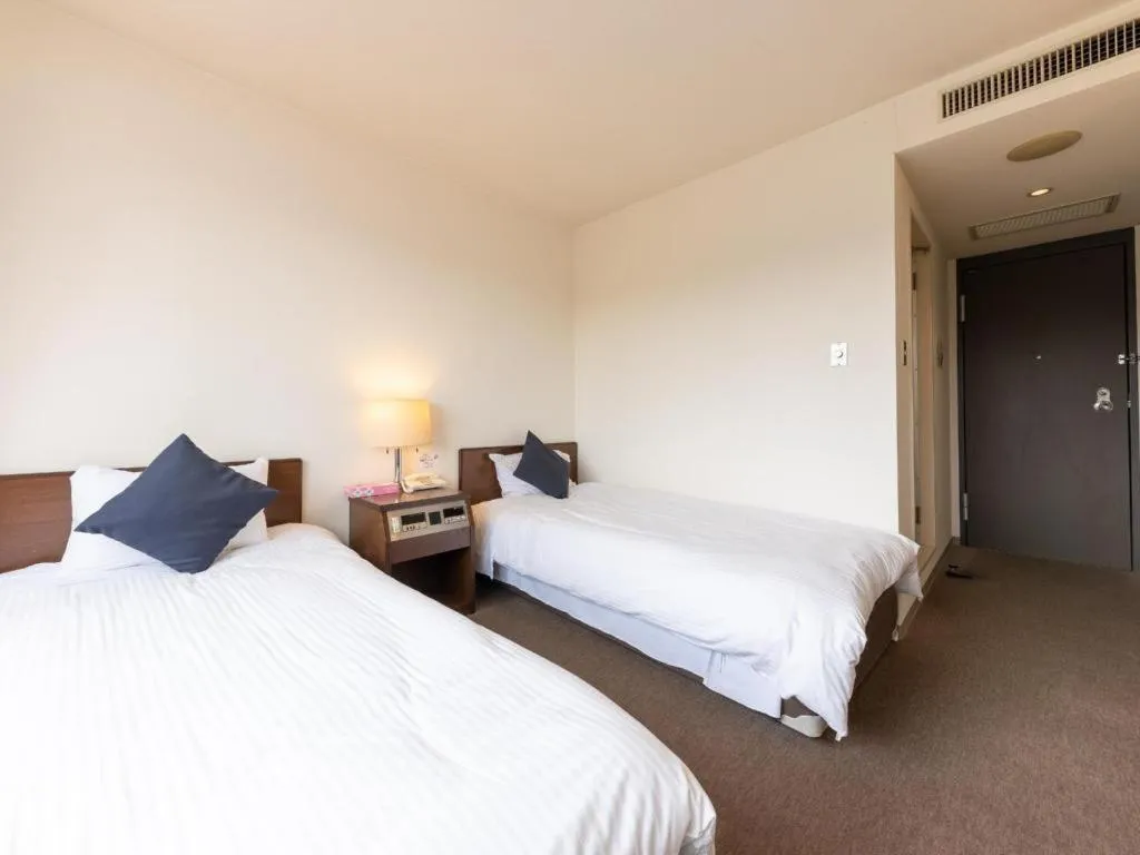 Bed in Tabist Yabuki Station Hotel