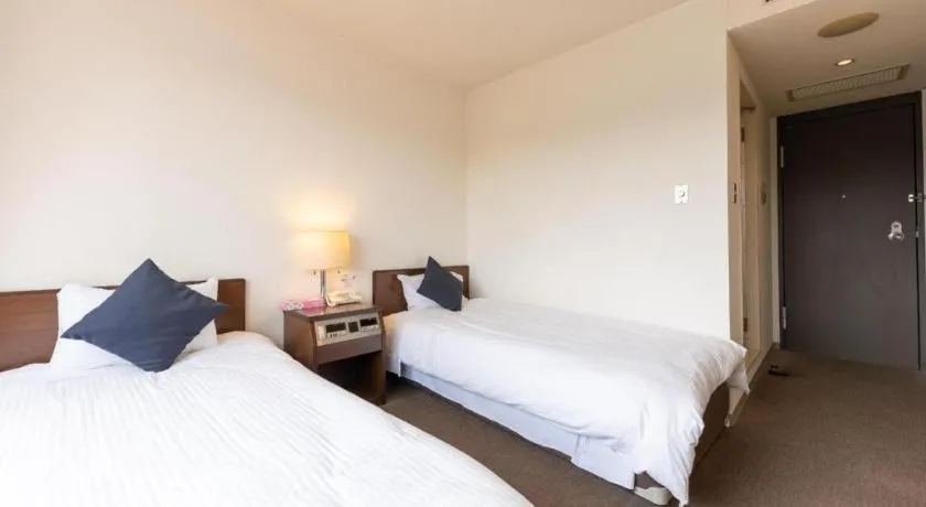 Bed in Tabist Yabuki Station Hotel