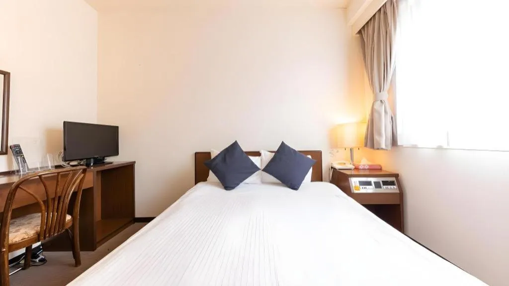 Bed in Tabist Yabuki Station Hotel