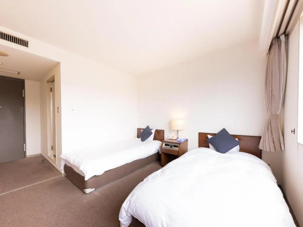 Bed in Tabist Yabuki Station Hotel