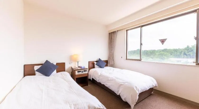 Bed in Tabist Yabuki Station Hotel