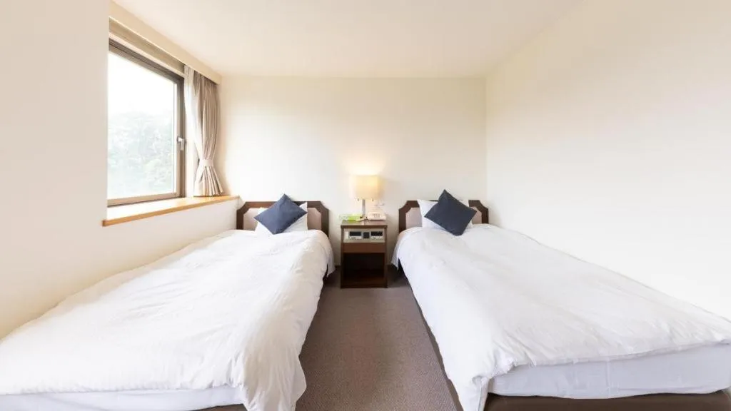 Bed in Tabist Yabuki Station Hotel