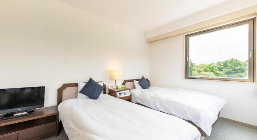 Bed in Tabist Yabuki Station Hotel