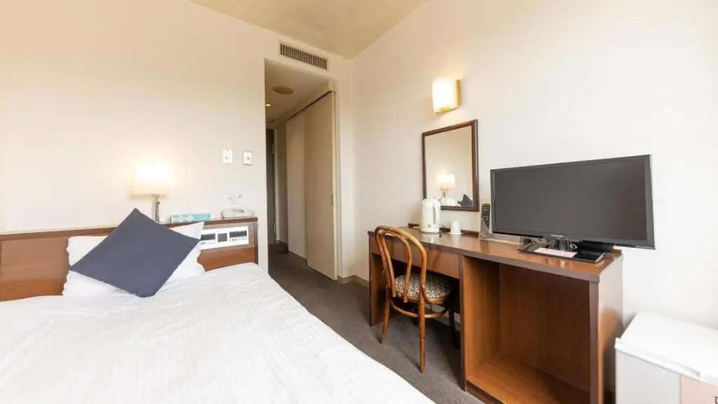 Bed in Tabist Yabuki Station Hotel