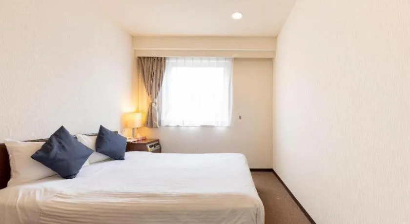 Bed in Tabist Yabuki Station Hotel