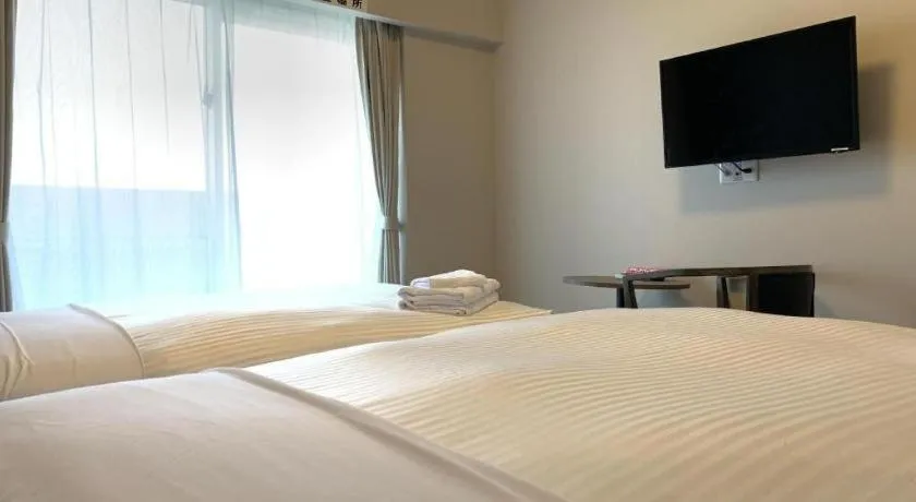 Bed in Mr.KINJO LINK in KUME NAHA