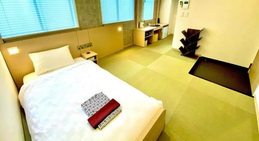 Bed in NAMBA EBISU HOTEL