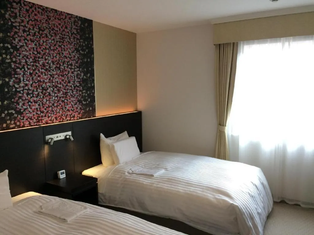 Bed in JR-EAST HOTEL METS NAGAOKA