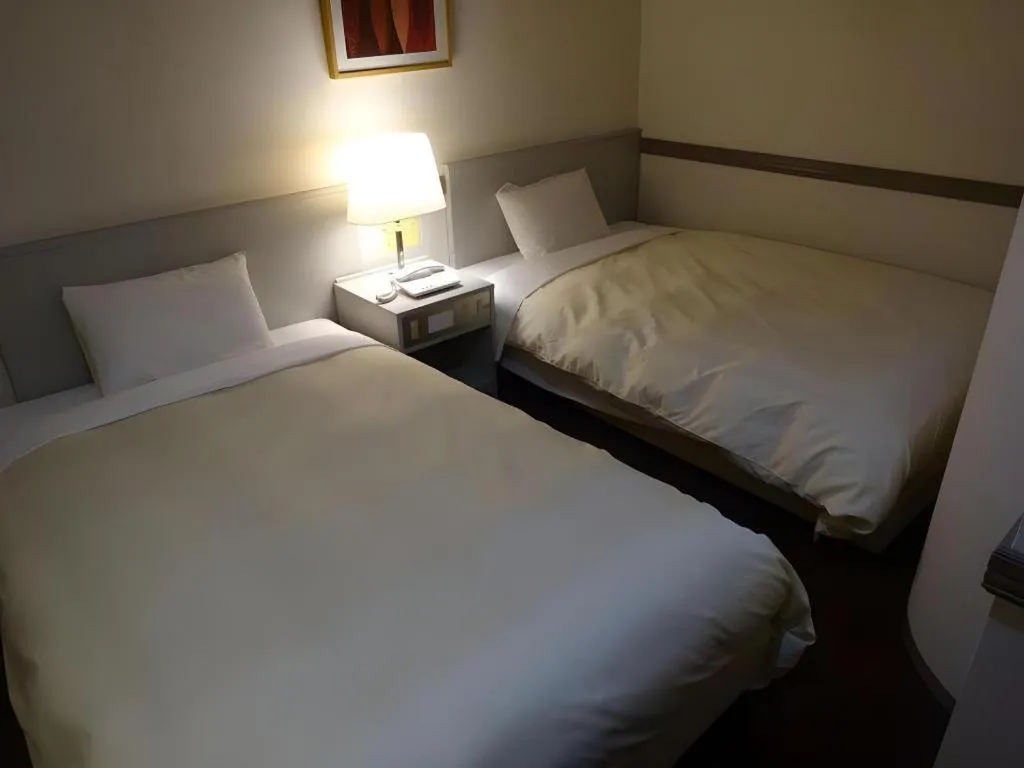 Bed in Matsumoto Wellton Hotel