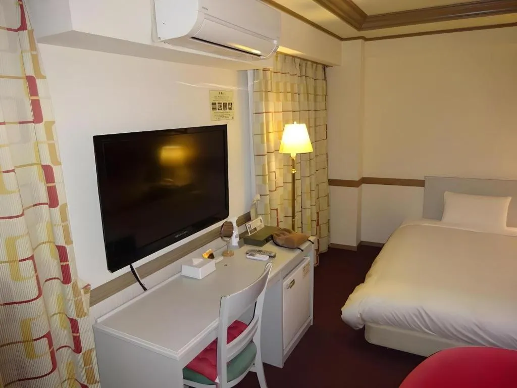 Bed in Matsumoto Wellton Hotel