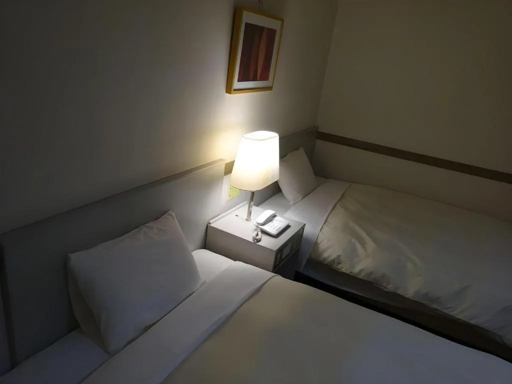 Bed in Matsumoto Wellton Hotel