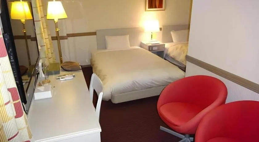 Bed in Matsumoto Wellton Hotel