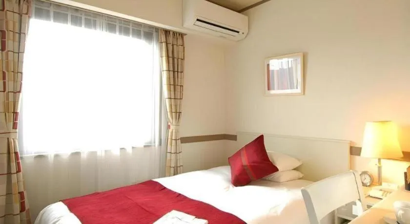 Bed in Matsumoto Wellton Hotel