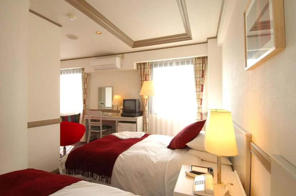 Bed in Matsumoto Wellton Hotel