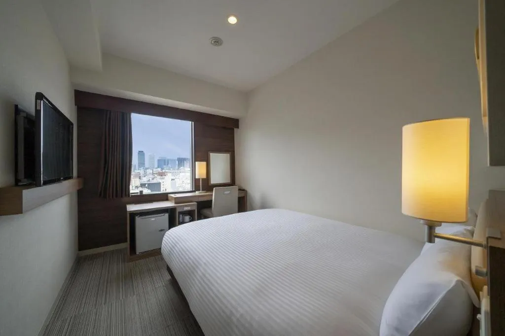 Bed in Hotel Oriental Express Nagoya Sakae