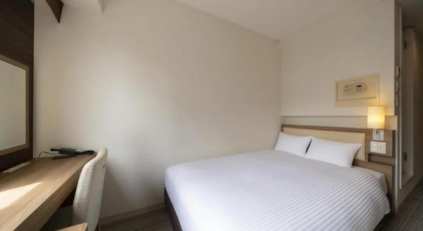 Bed in Hotel Oriental Express Nagoya Sakae